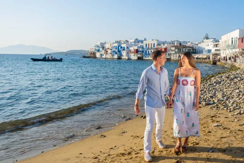 Traveler posing in a whitewashed alley of Mykonos Town on a private Mykonos photoshoot