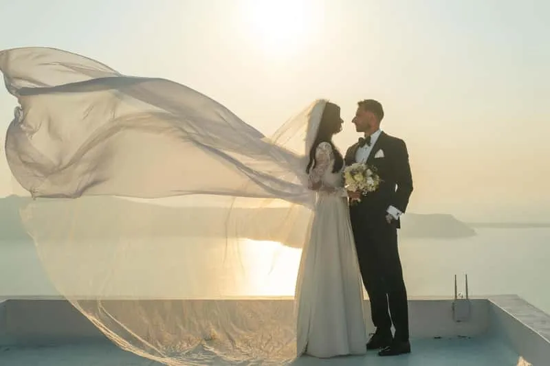 Bride and groom embracing at golden hour in Little Venice during a wedding Mykonos photoshoot